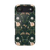 Forest iPhone case featuring floral and animal designs in green, with deer and white flowers on a dark background.