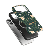 Forest iPhone case featuring floral and deer patterns on a dark green background, layered over two other phone cases.