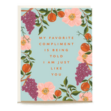 Fruit Garden Mother's Day card featuring floral and fruit illustrations with the text "My favorite compliment is being tol...
