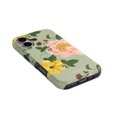 Garden Rose iPhone case featuring pink and yellow floral designs on a light green background, angled for display.