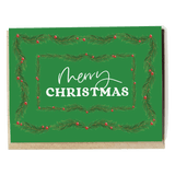 Garland holiday card featuring a green background with pine branches and red berries, displaying "Merry Christmas" text.
