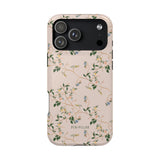 Grove iPhone case featuring a floral design with green vines and small blue flowers on a light pink background.