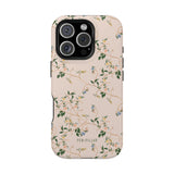 Grove iPhone case featuring a floral design with green leaves and blue flowers on a light pink background.