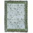 Grove woven blanket featuring a light blue background with floral patterns and green borders, fringed edges.