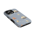 Harbor iPhone case featuring a light blue background with sailboat illustrations in various colors and sizes.