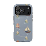 Harbor iPhone case featuring a blue background with various sailboat designs in red, white, and cream colors.