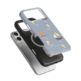 Harbor iPhone case featuring a light blue design with sailboats, layered over black and silver cases.