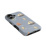 Harbor iPhone case featuring a light blue background with sailboat patterns in various colors and styles.