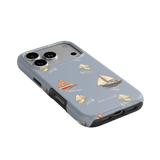 Harbor iPhone case featuring a light blue background with sailboats and yachts in various colors and styles.
