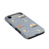 Harbor iPhone case featuring a light blue background with sailboat patterns in various colors and styles.
