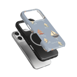 Harbor iPhone case featuring a light blue design with sailboats, layered over black and clear cases.