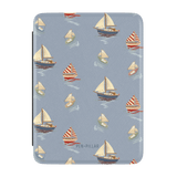 Harbor Kindle case featuring a nautical design with various sailboats on a light blue background.