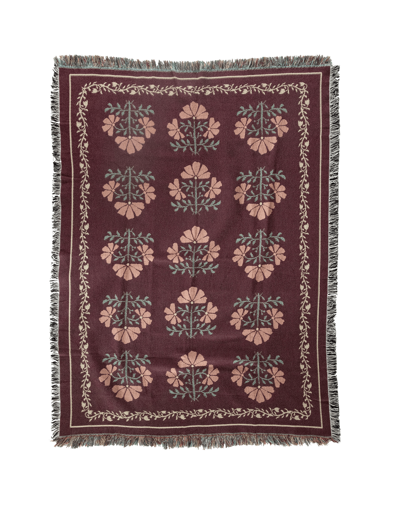 Haven woven blanket featuring a floral pattern in pink and green on a burgundy background with fringed edges.