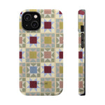 Heirloom iPhone case featuring a geometric pattern with multicolored squares and triangles on a light background.