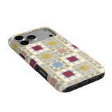 Heirloom iPhone case featuring a geometric pattern in pastel colors with cutouts for camera and ports.