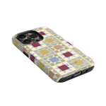 Heirloom iPhone case featuring a geometric pattern in pastel colors with a black border and cutouts for buttons and ports.