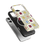 Heirloom iPhone case featuring a geometric pattern in pastel colors, layered over a black protective case.