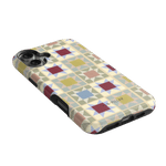 Heirloom iPhone case featuring a geometric pattern in pastel colors with a glossy finish and cutouts for buttons.