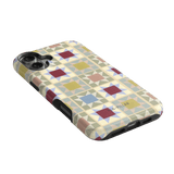 Heirloom iPhone case featuring a geometric pattern in pastel colors with a glossy finish and cutouts for buttons.