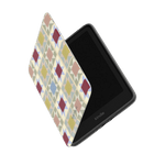 Heirloom Kindle case with a geometric pattern in pastel colors, partially open to show the screen.