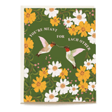 Hummingbird wedding card featuring two hummingbirds and floral designs in yellow and white on a green background.