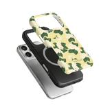 Hydrangea iPhone case featuring a floral design with green leaves on a yellow background, stacked with black and clear cases.