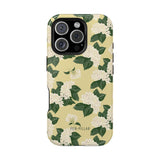 Hydrangea iPhone case featuring a floral design with white flowers and green leaves on a yellow background.