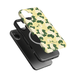 Hydrangea iPhone case featuring a floral design with white hydrangeas on a yellow background, layered over black cases.