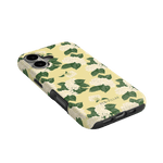 Hydrangea iPhone case featuring a yellow background with white hydrangea flowers and green leaves, angled view.
