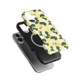 Hydrangea iPhone case featuring a floral design with yellow background and green leaves, stacked over a black case.