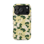 Hydrangea iPhone case featuring a floral design with white flowers and green leaves on a light yellow background.