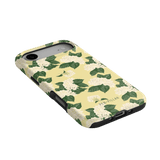 Hydrangea iPhone case with a yellow background and white floral pattern, angled view showcasing design details.