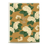 Hydrangea thank you card featuring cream flowers on a gold background with green leaves and elegant script text.