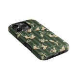 In the Garden iPhone case featuring a green background with floral and gardening tool patterns.