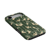 In the Garden iPhone case featuring a green background with floral and gardening tool patterns.