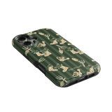 In the Garden iPhone case featuring a green background with floral and gardening tool patterns.