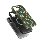 In the Garden iPhone case featuring a green background with floral and plant designs, stacked on black and silver phone ca...