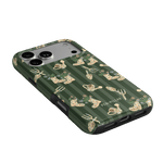 In the Garden iPhone case featuring a green background with floral and gardening-themed illustrations.