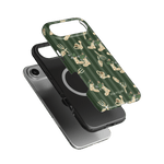 In the Garden iPhone case featuring a green background with floral and gardening tool designs, shown from multiple angles.