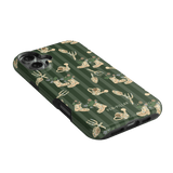 In the Garden iPhone case featuring a green background with floral and gardening tool illustrations.