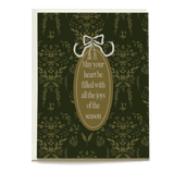 Laurel holiday card featuring a dark green floral pattern and a gold oval with the message, "May your heart be filled with...