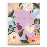 Lilac garden birthday card featuring floral illustrations and the text "Happy Birthday" in gold lettering.