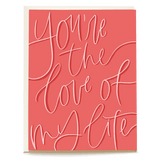 You're the love of my life Valentine's Day card with coral background and white cursive lettering.