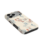 Mariner iPhone case featuring a cream background with colorful marine life illustrations, including shells and crabs.