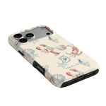 Mariner iPhone case featuring a cream background with colorful crab and shell illustrations.