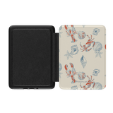 Mariner Kindle case with lobster and seashell patterns on a cream background, featuring a black interior.