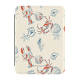 Mariner Kindle case featuring a cream background with red lobsters, blue crabs, and seashell illustrations.