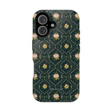 Meadow iPhone case featuring a dark green floral pattern with pink flowers and gold accents.