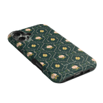 Meadow iPhone case featuring a floral pattern with pink flowers on a dark green background.
