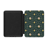 Meadow Kindle case with a dark green floral pattern and a textured black interior, open at an angle.
